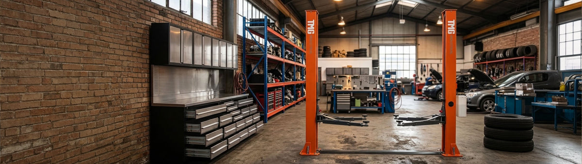 A workshop with vehicle lifts, tool storage and shelving