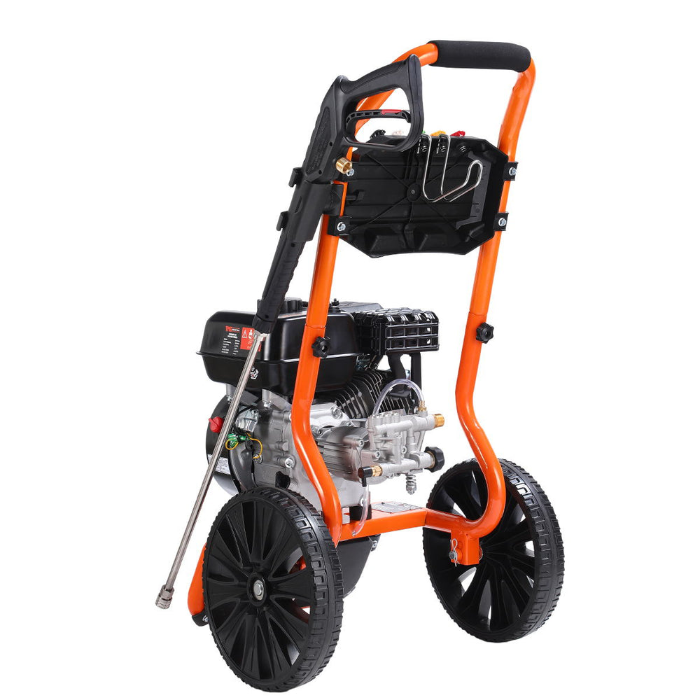 Rear three-quarter view of pressure washer showing handle and nozzle holder.