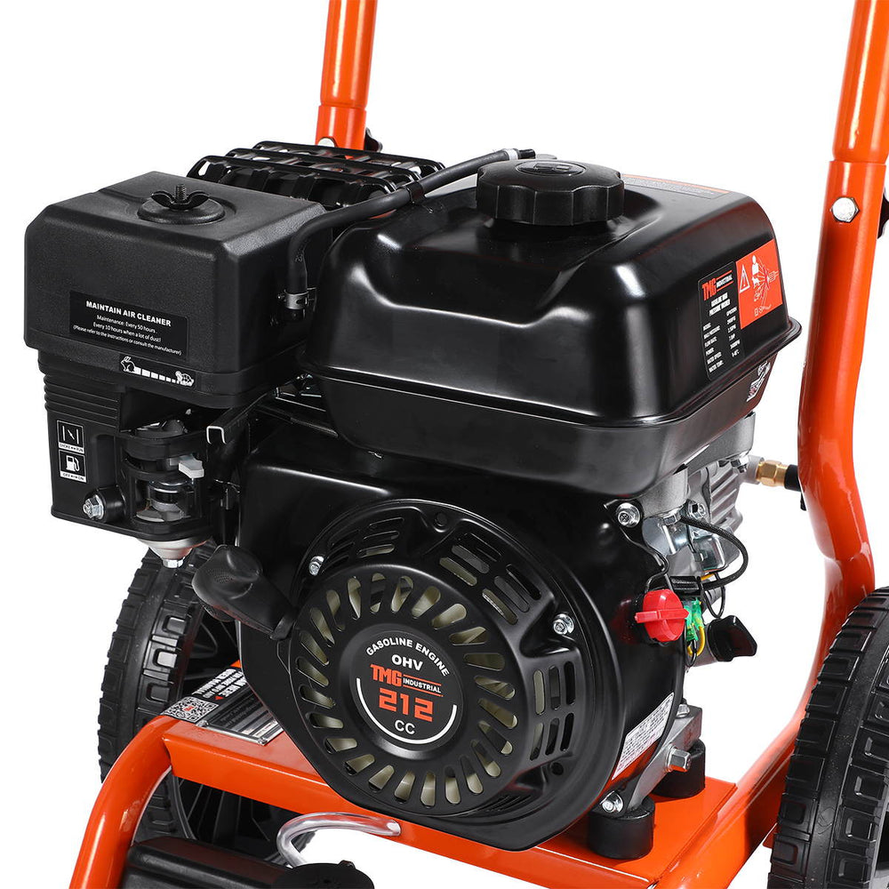 Close-up of pressure washer engine and fuel tank on orange frame.