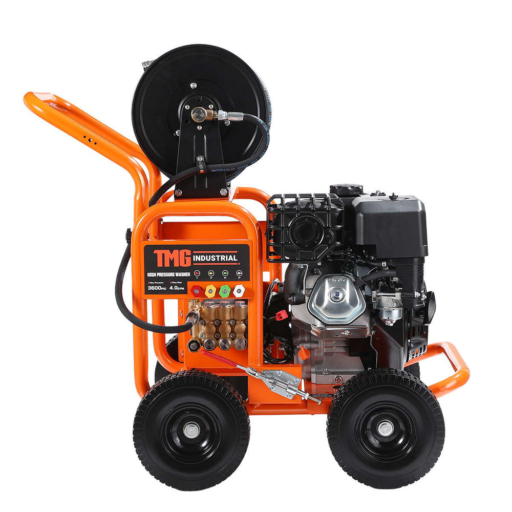Three-quarter perspective showing TMG label, engine and hose reel on pressure washer