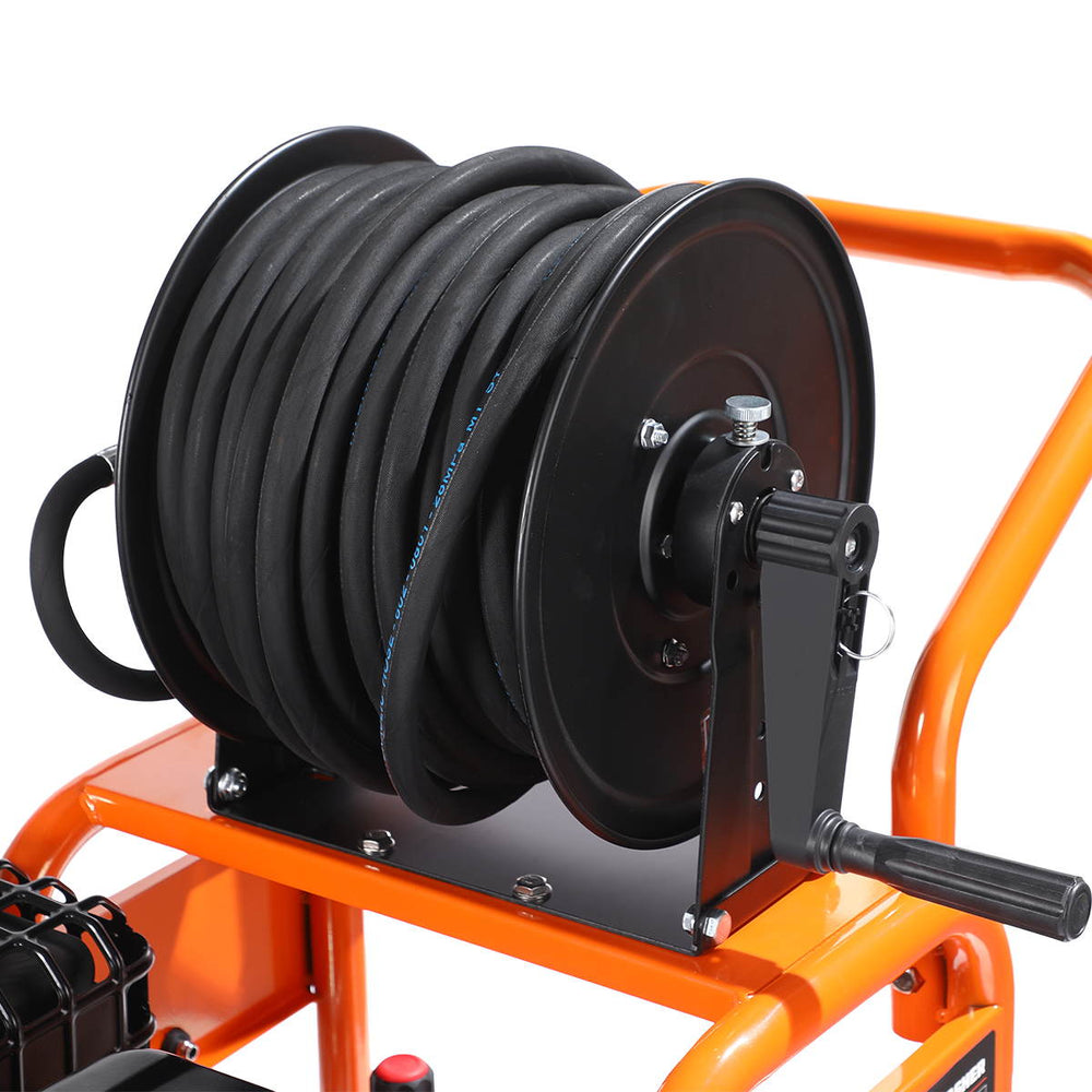 Hose reel with coiled hose and hand crank mounted on pressure washer