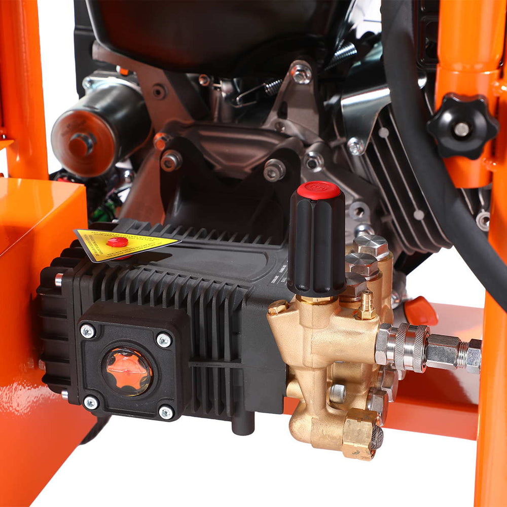 Close-up of brass pump, pressure regulator knob and fittings on pressure washer