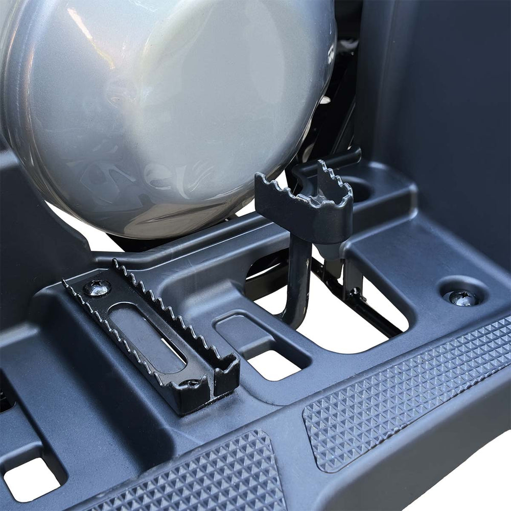 Rear footpeg and exhaust area detail on TMG ATV.