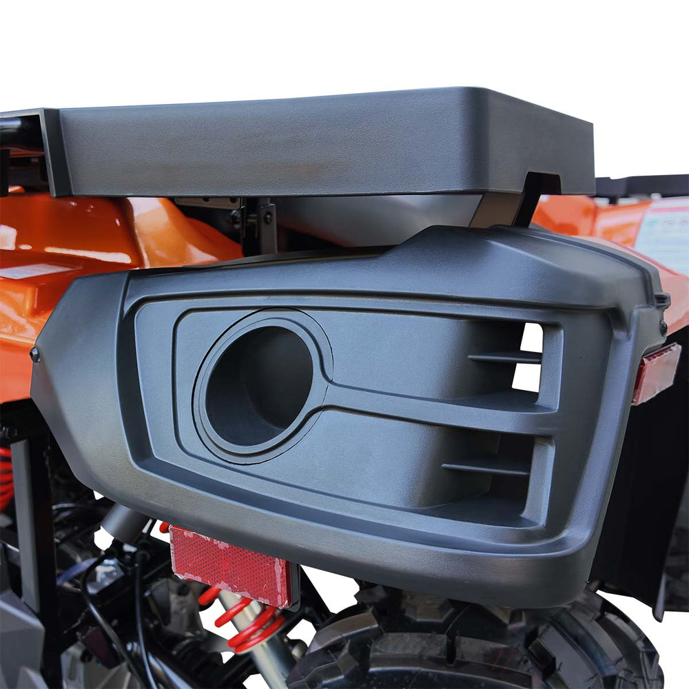 Rear side storage recess and molded panel on orange TMG ATV.